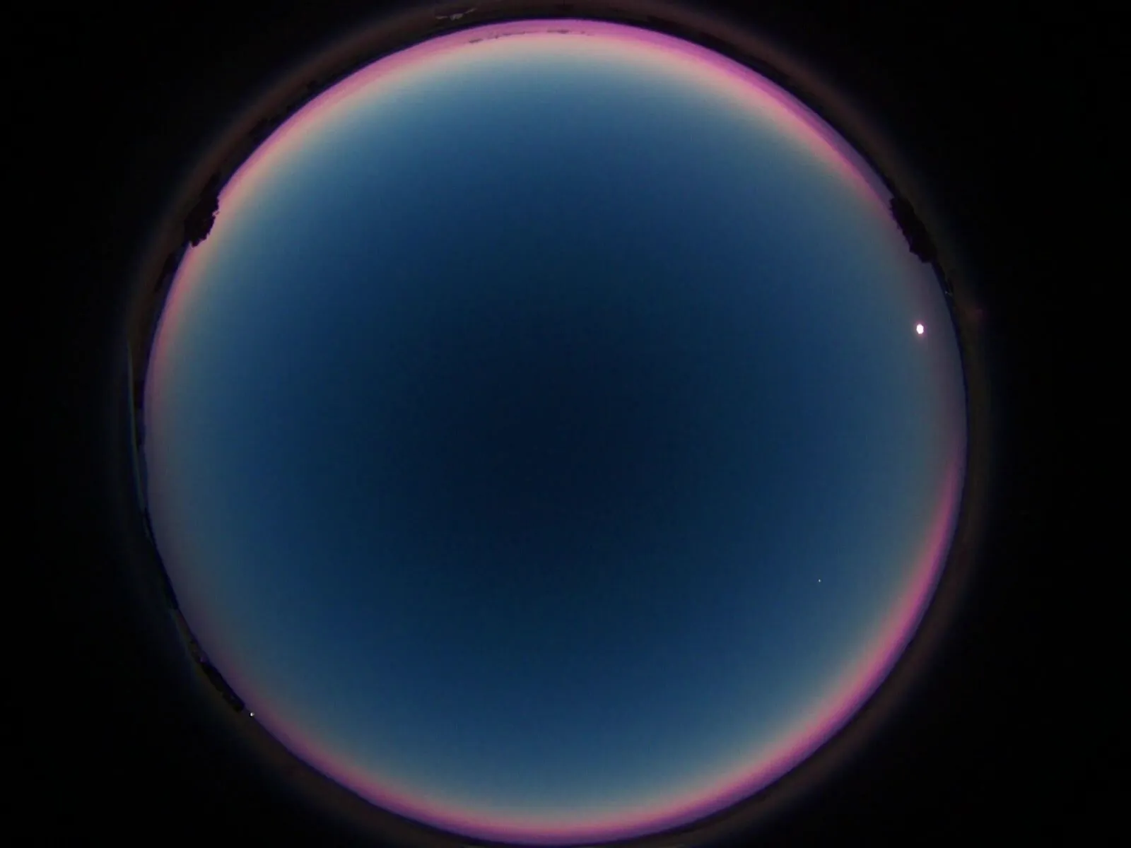 AMASC01 all-sky frame during totality of the 12 August 2026 solar eclipse showing the Moon's shadow in the atmosphere