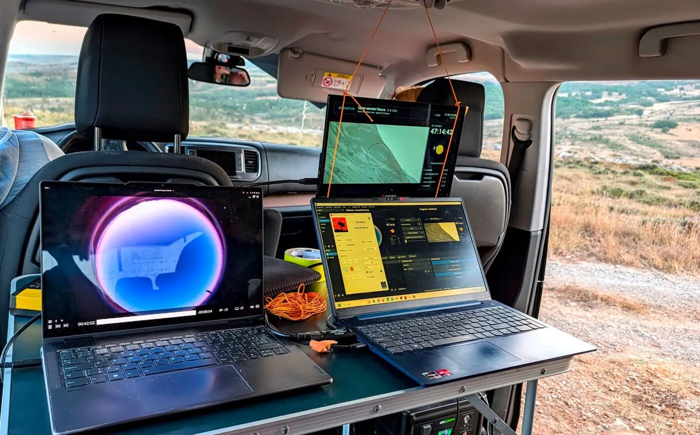 Laptop showing AMASC01 all-sky footage next to the OBS broadcast setup