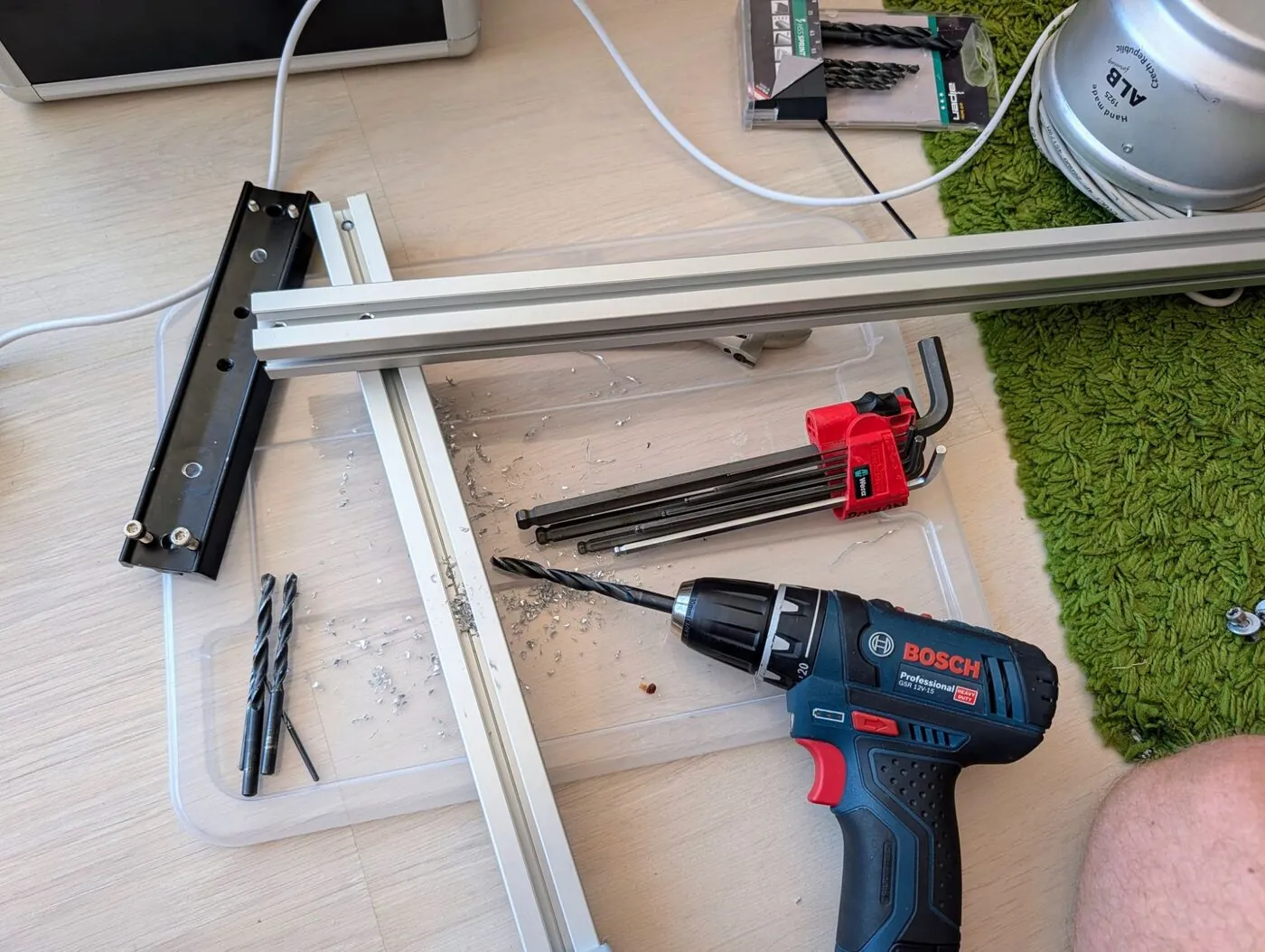 Aluminium profiles for the roof rack being drilled and assembled at the accommodation in Spain